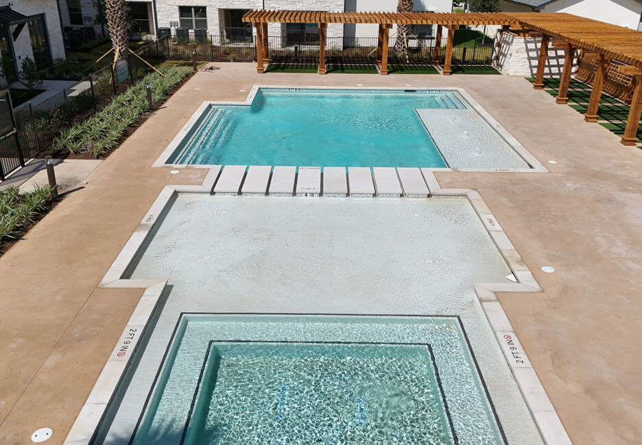 commercial pool with wading area and spa